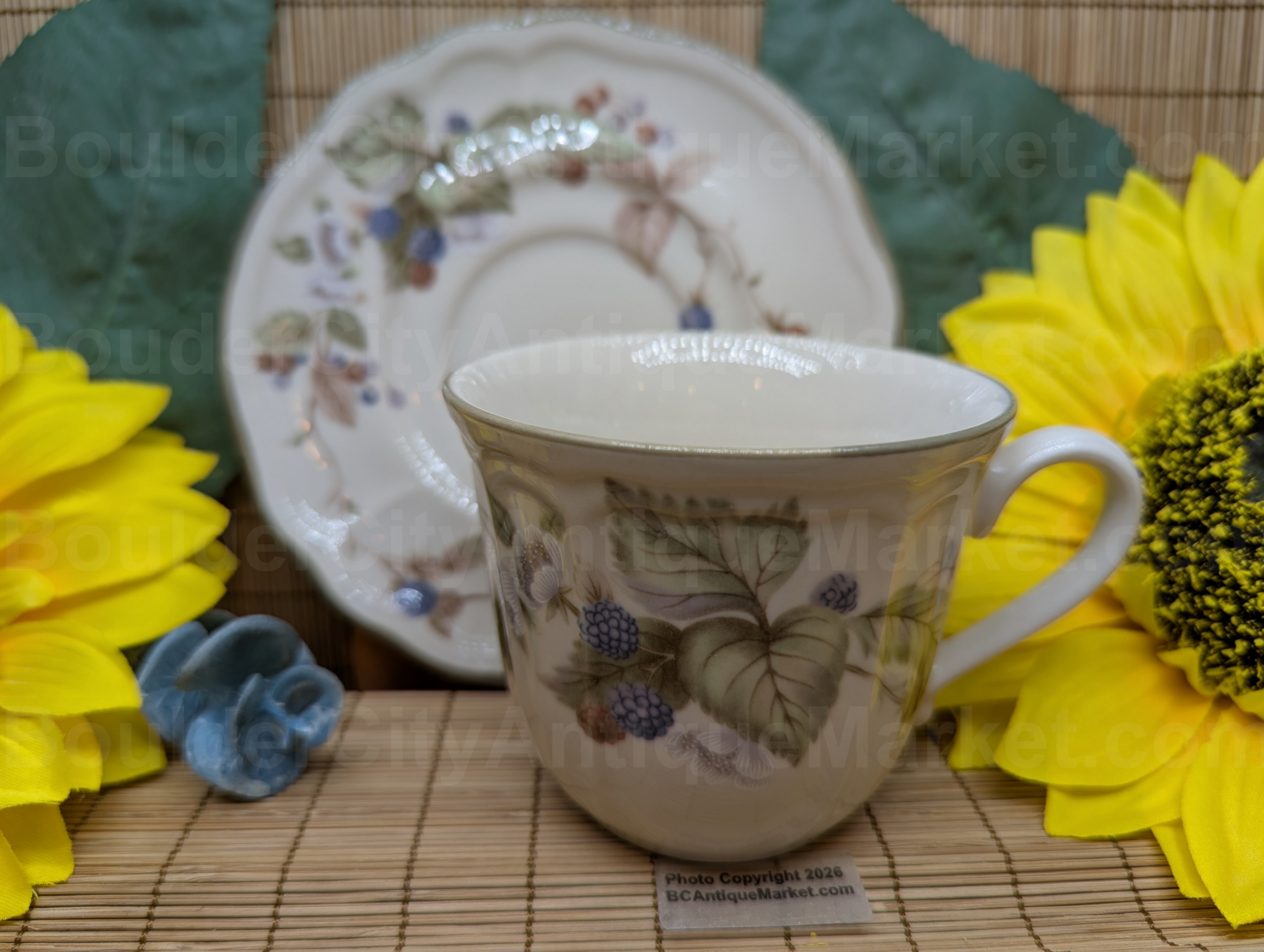 Epoch Summer Hill (pattern E530) by Noritake is stoneware manufactured in Korea. The scalloped edge 5 7/8" saucer and 3 1/2 inch cup are from 1990-1993 and have a beautiful blackberry design, featuring the vine, flowers and berries.