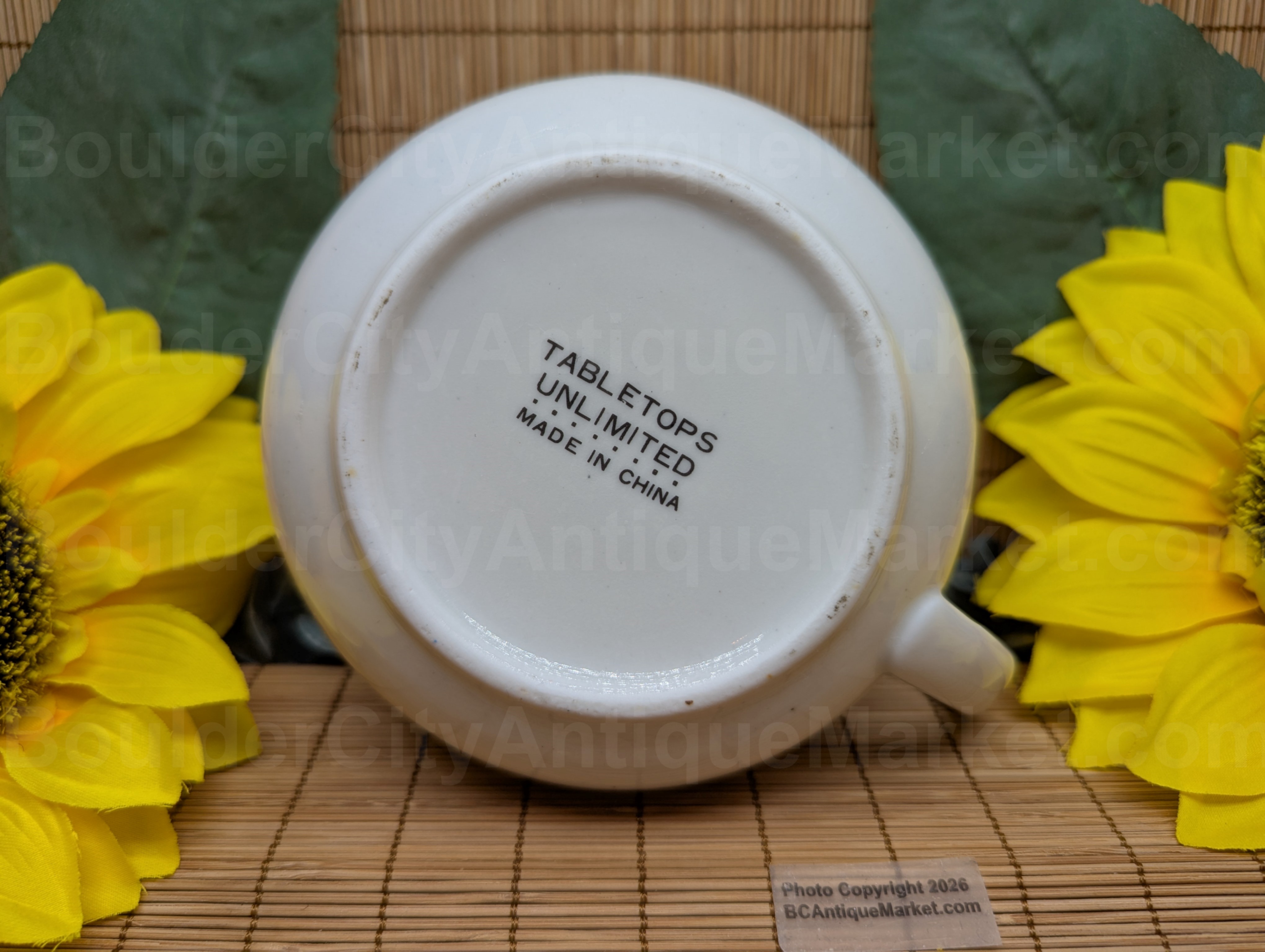 Onion Soup recipe mug from Tabletops Unlimited. Green letters and bright graphics surround the "recipe card" on the mug. Bottom of mug view.