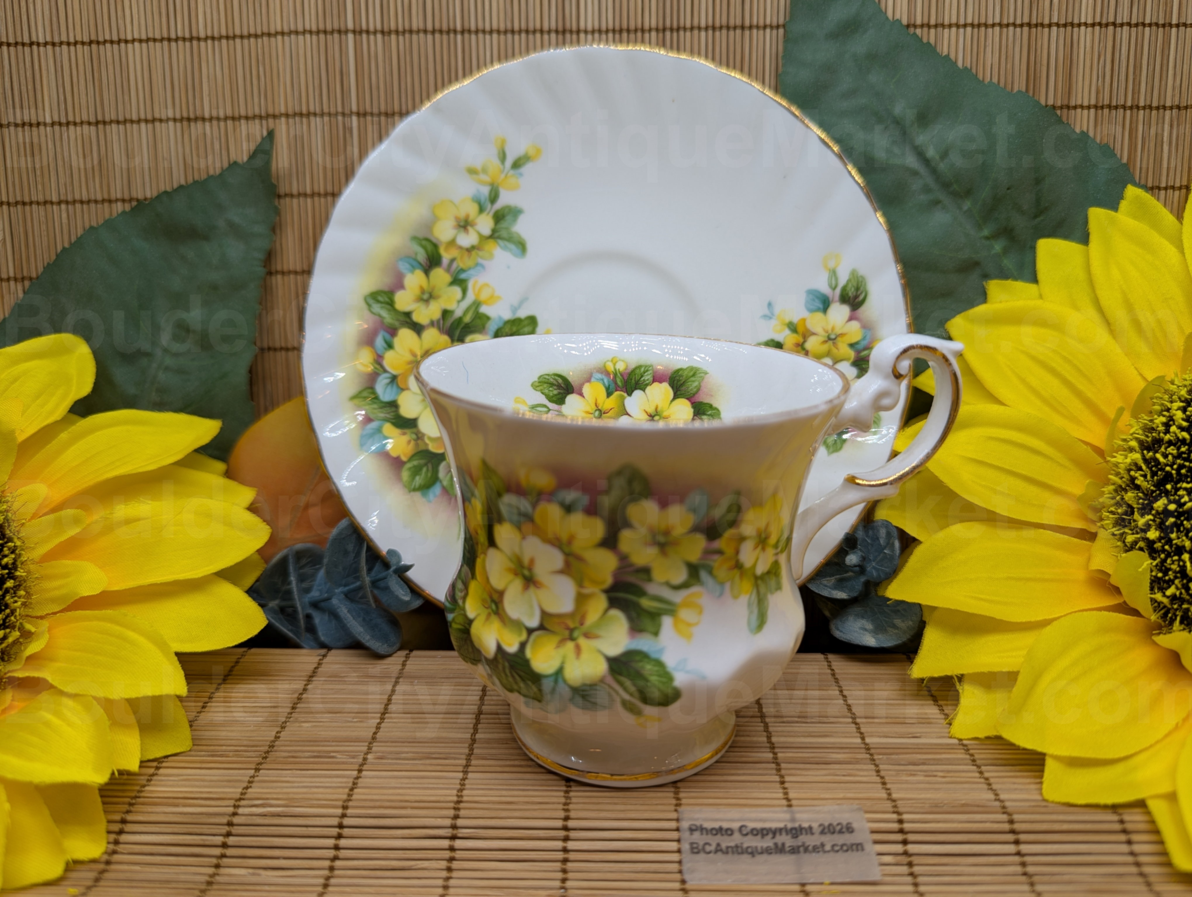 This Rosina Queen's Pottery Yellow Primrose 3" diameter footed teacup and 5 3/4" scalloped saucer have gold details and beautiful detail.  This set likely dates from 1941-1955 and was made in the factory at Sutherland Road, Longton, Stoke-on-Trent, London.