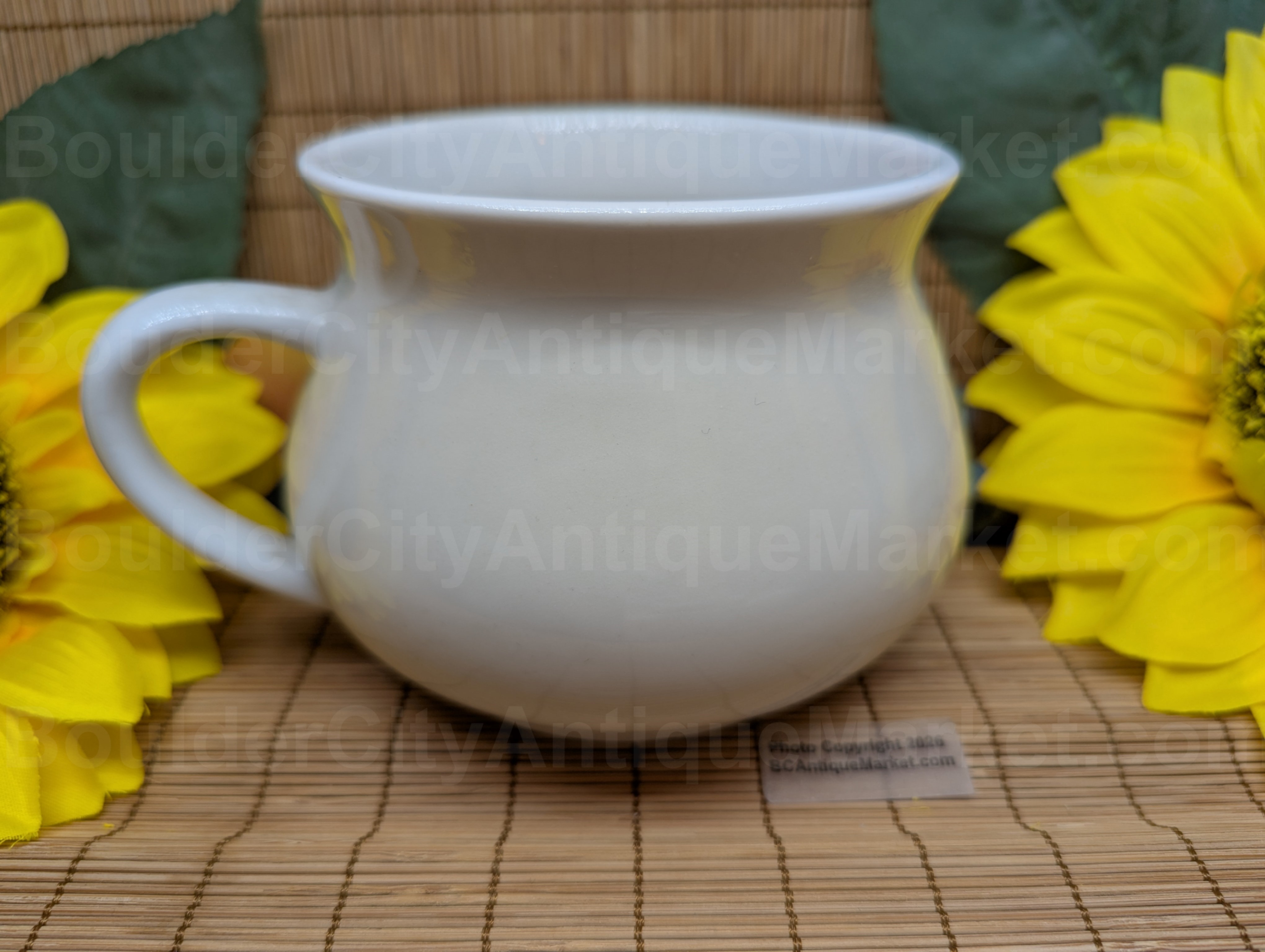 Cream of Mushroom soup recipe mug by Tabletops Unlimited. Graphics of mushrooms and vegetables are in browns and oranges. Back side view.