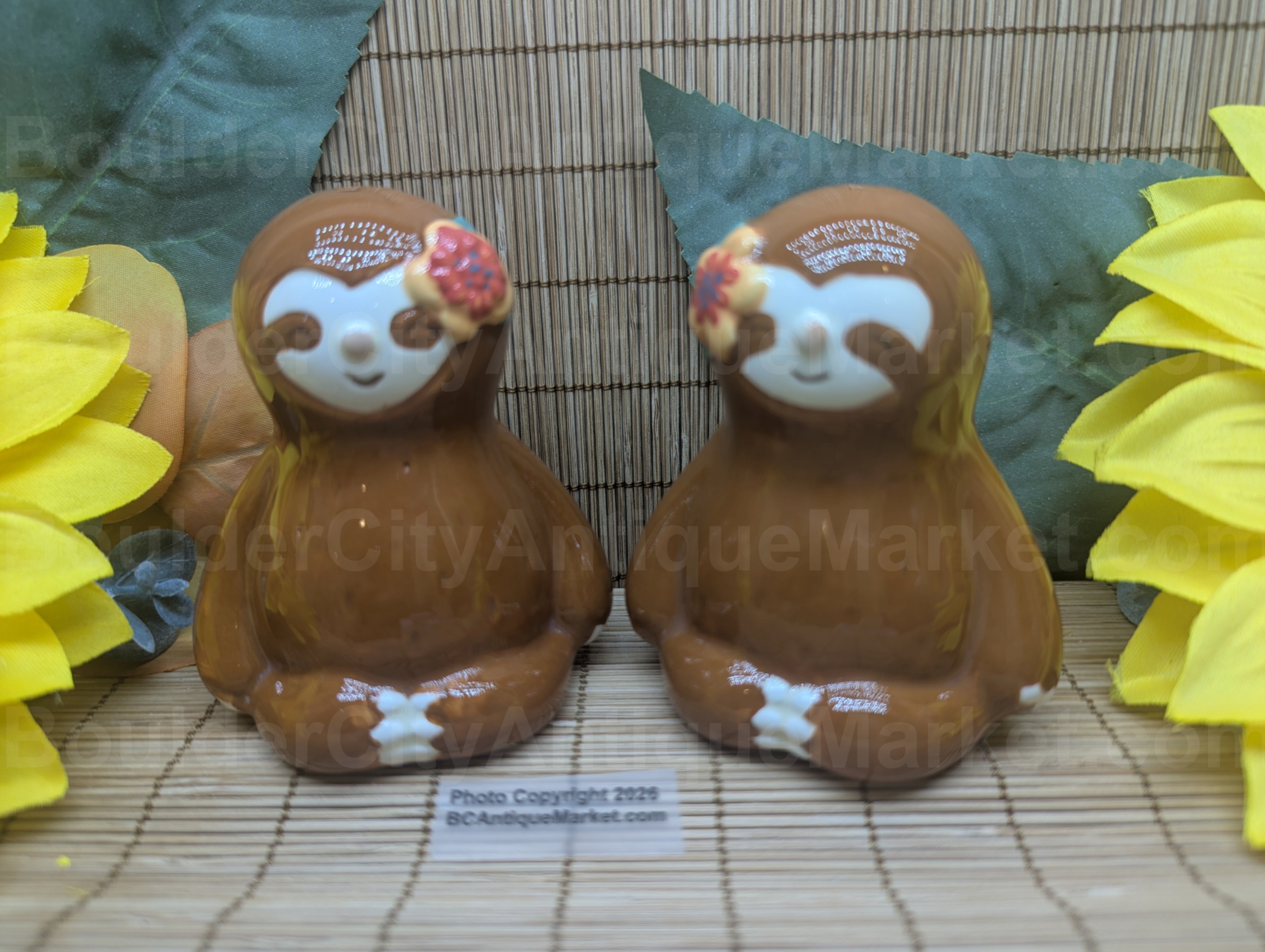 Sloths with a floral detail, each shaker stands 3 inches tall and are brand new.